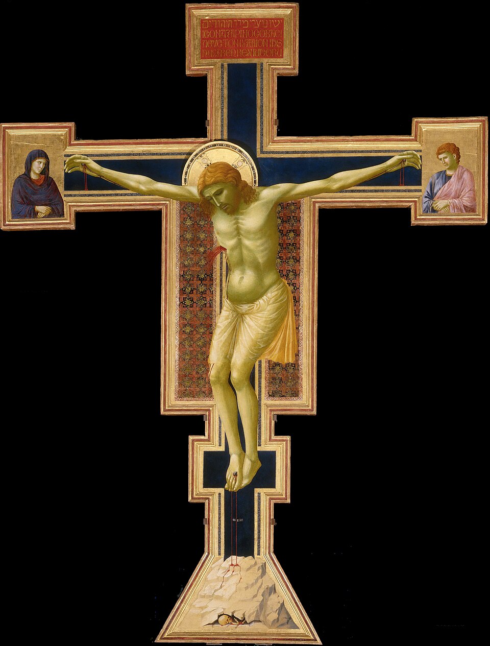 Christ’s body hangs heavily from a painted wooden cross, with Mary and John at the ends of its arms
